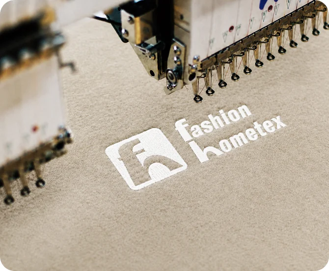 Fashion Hometex embroidering a custom logo on a private label blanket