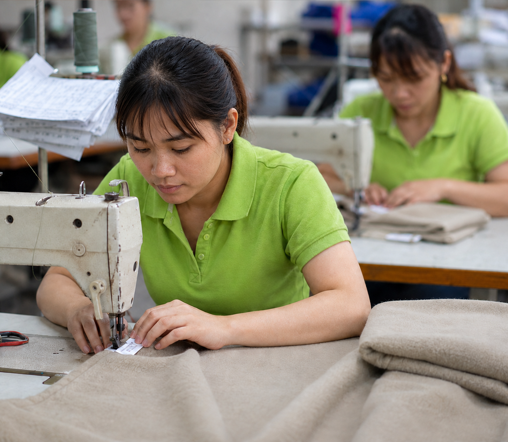 Fashion Hometex employee sewing a private label sherpa blanket in Thailand